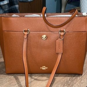 Brown leather coach saddle bag